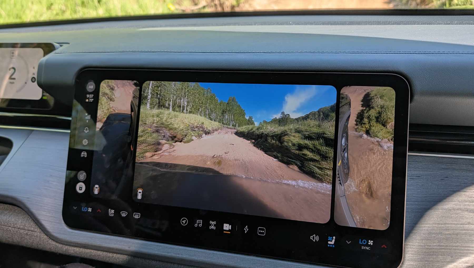 A Rivian R2's cameras on a water crossing