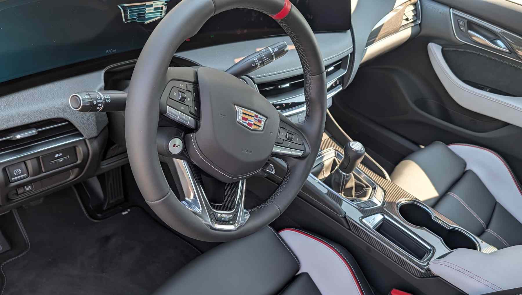 A Shot showing the location of the SD slot on the Cadillac Black Wing to the left of the steering wheel