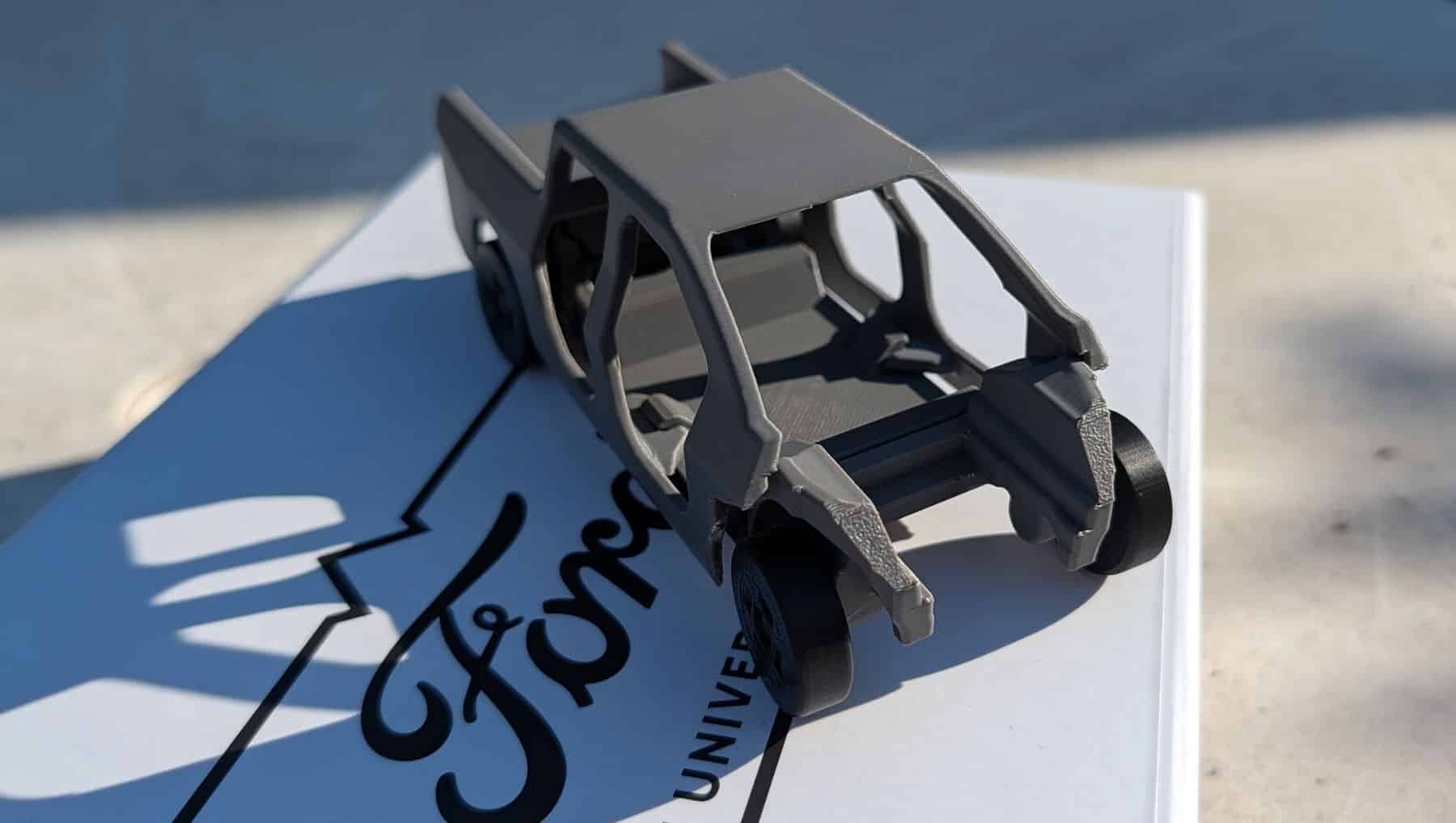 Top view of a fully assembled grey 3D printed model of a Ford Fathom