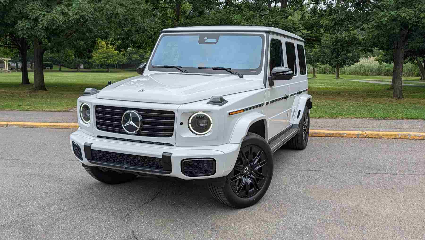 A front 3/4 view of a white electric G-Wagen
