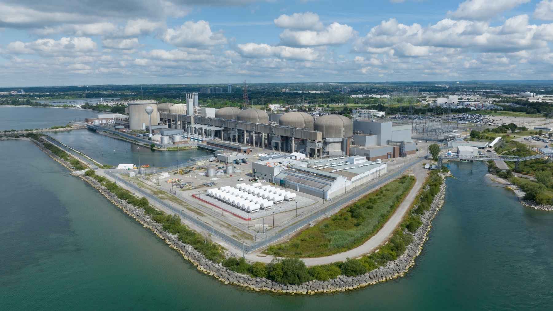 Canada is cutting holes in the roofs of four reactor buildings outside Toronto to lift out 48 boilers, twelve per reactor, and crews are rehearsing the cut on a full-scale concrete dome built 40 feet off the ground purely so nobody practices on a real one