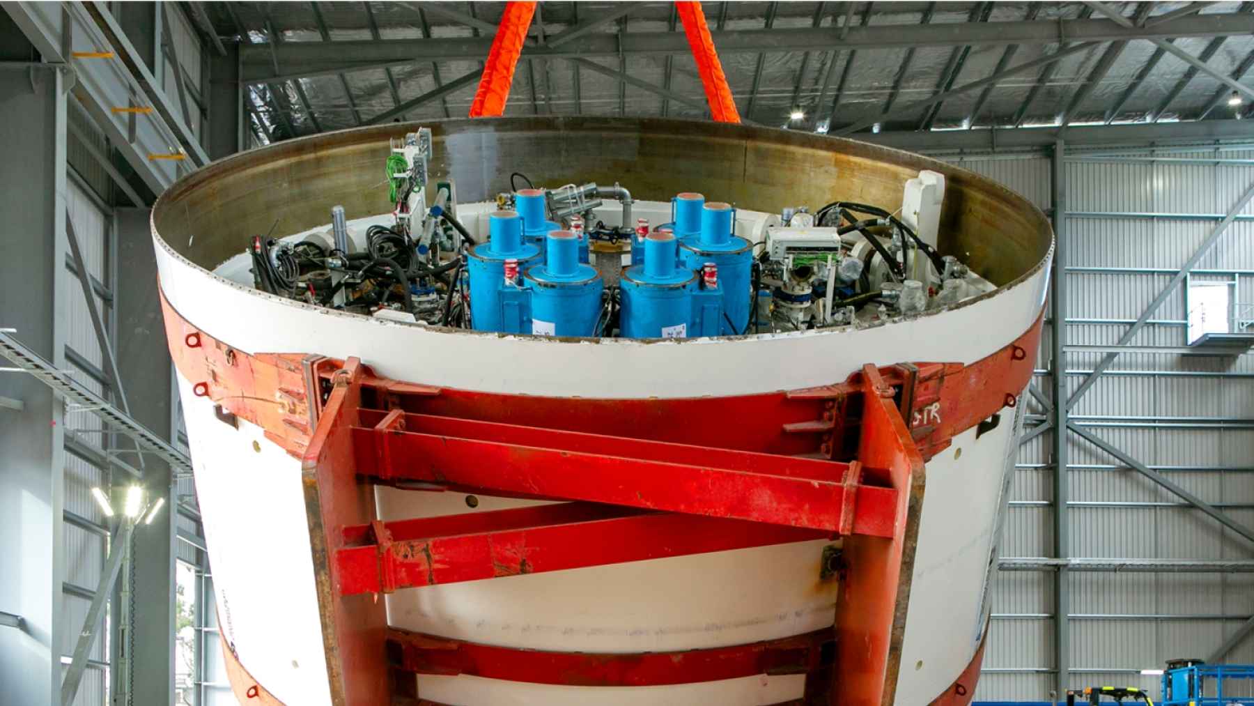 A 254-ton steel ring rolled out of an Australian port at night on a truck 180 feet long and wider than two traffic lanes, the front shield of a tunnel-boring machine so large that no road vehicle on Earth could move it assembled in one piece