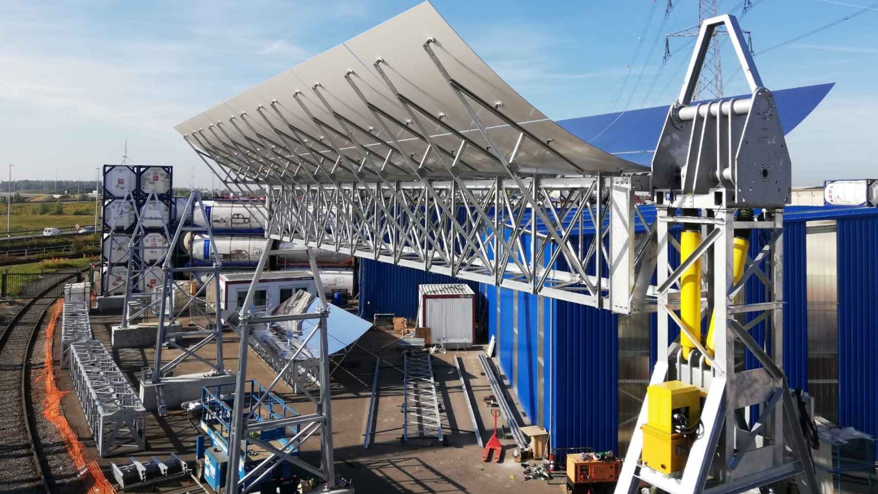 Curved solar mirrors stand more than 36 feet over a live railroad track in a Belgian port, on piles driven 66 feet into ground made of dredged sand, and the plant has never made a watt of electricity, because everything it catches leaves as 145-psi steam