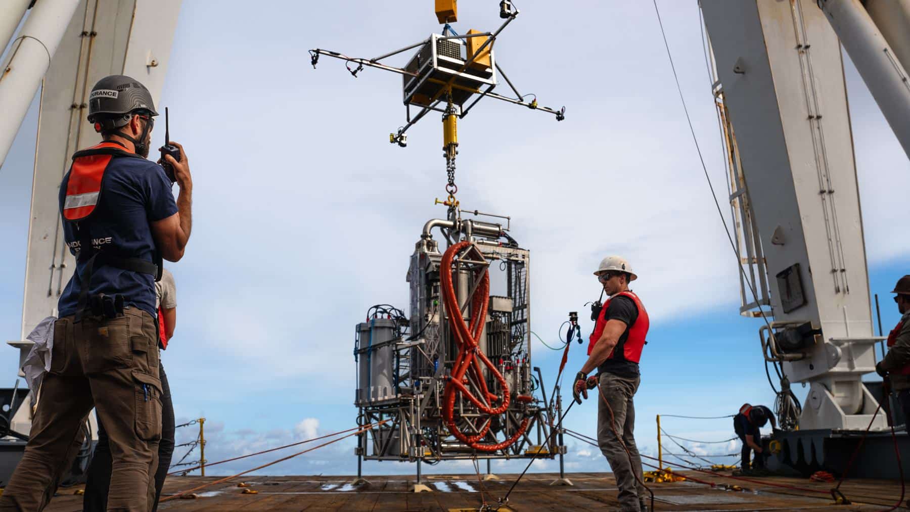 A 3-ton power plant sat 5,000 feet down on an active underwater volcano 300 miles off Oregon, spun its turbine to 26,000 rpm on 538-degree vent water and made more power than it used for 8.7 seconds before its own battery protection shut it off, run from a room in Seattle