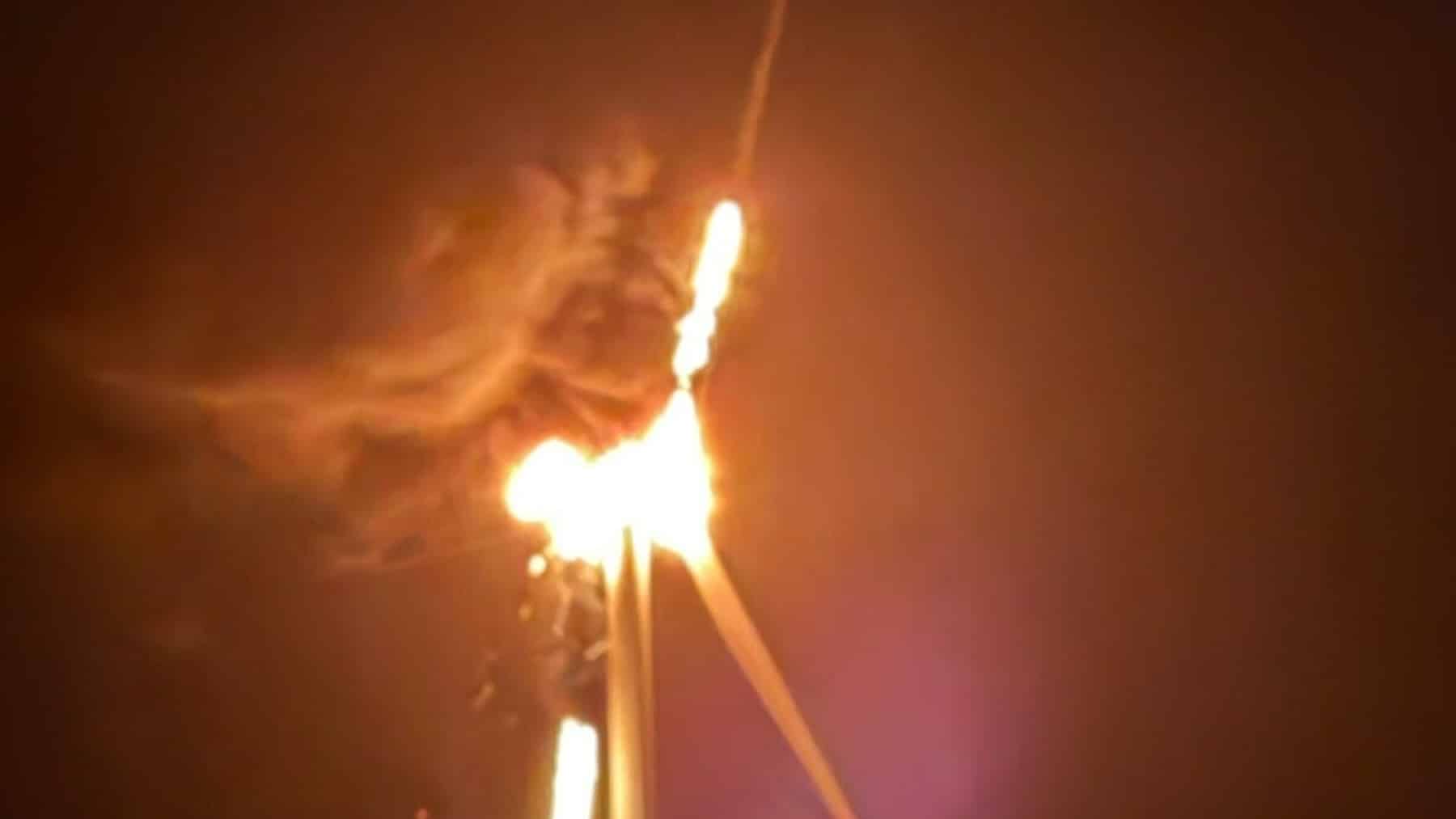 A 459-foot wind turbine standing on a dike on the German North Sea coast caught fire 276 feet up at half past ten at night, and 60 firefighters drove out to it and stood on the ground watching it burn, because the tallest ladder they own reaches a little past 100 feet