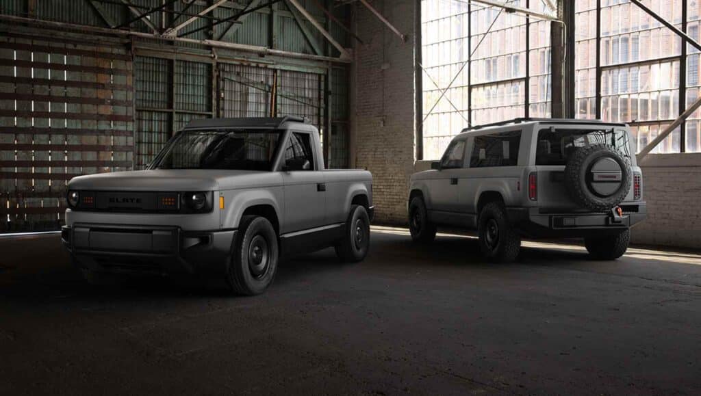 Two Slate trucks parked in a warehouse