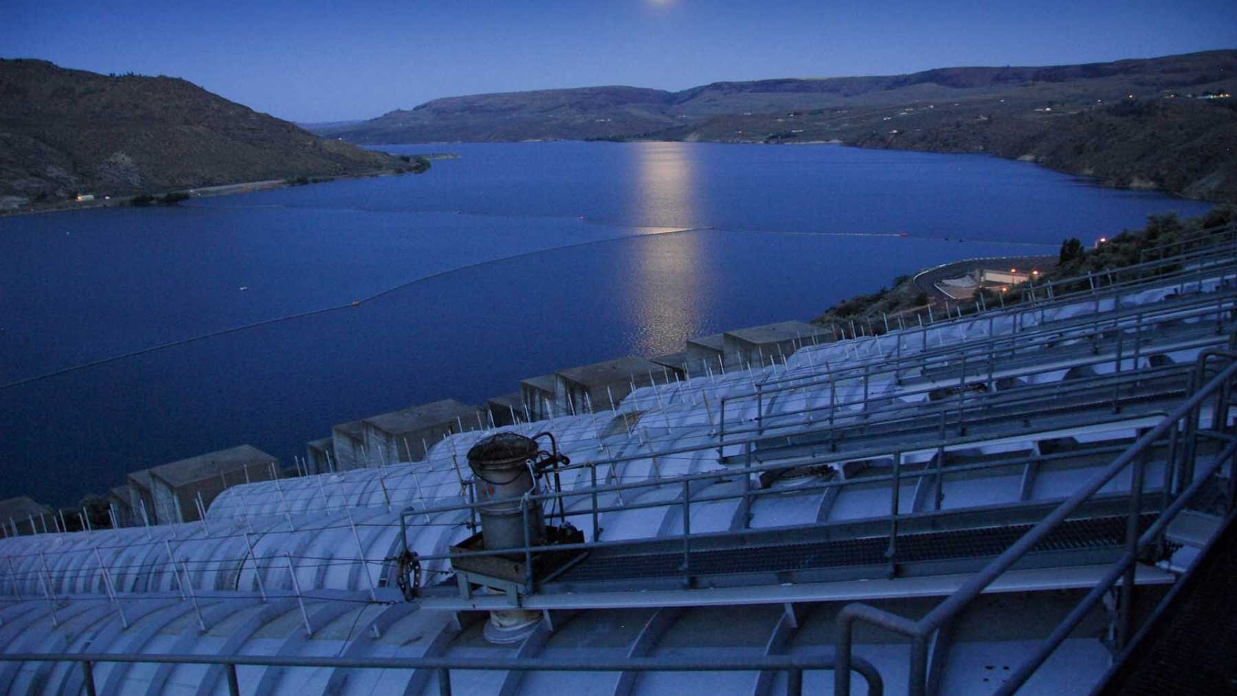 Six 65,000-horsepower pumps have spent 75 years pushing water 280 feet uphill beside the largest power plant in the United States to irrigate 670,000 acres of farmland, and the building they work from keeps most of its floors hidden under the reservoir itself