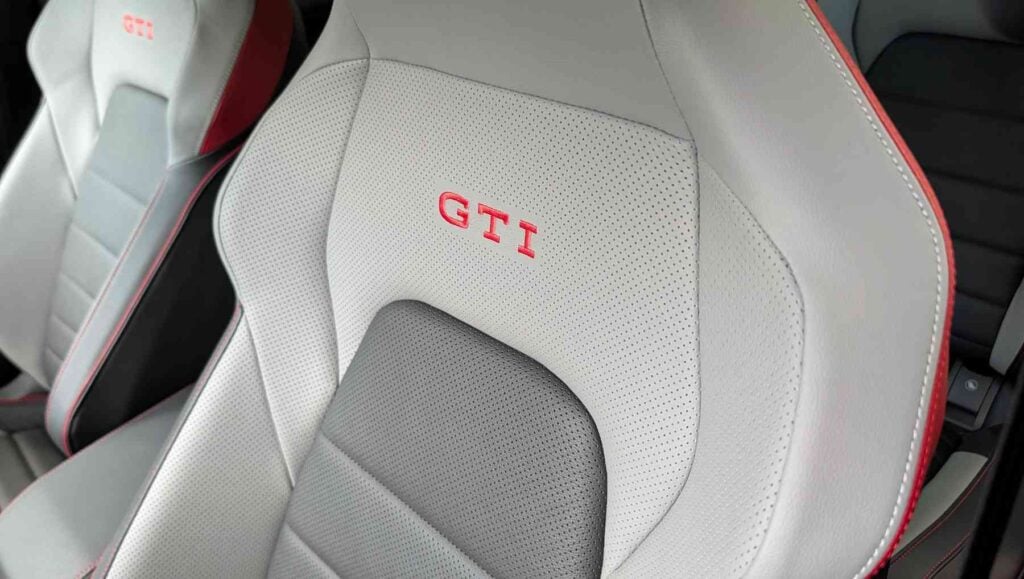 The seats in a A side view of a blue 2026 Volkswagen Golf GTI