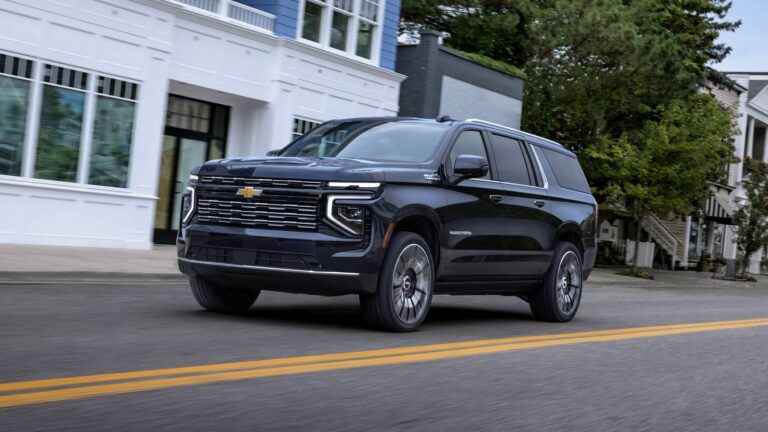 2026 Chevrolet Suburban, High Country front three-quarter view in black