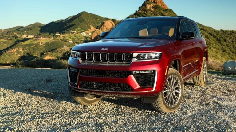 2026 Jeep Grand Cherokee in red, front three-quarter view