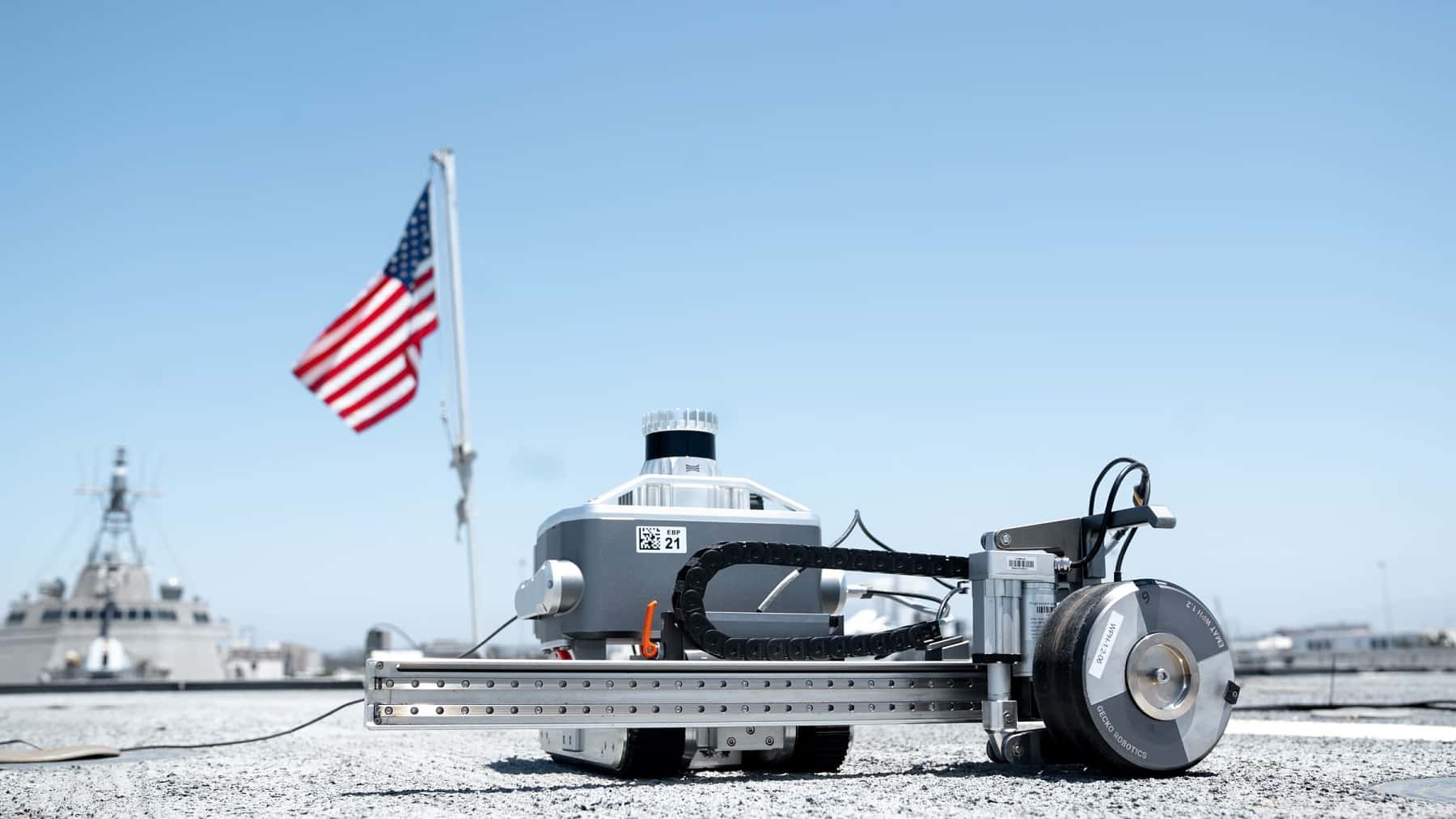 A Pittsburgh robot rolls across a warship’s flight deck like a paint roller and reads the steel under the non-skid coating without stripping it, cut one repair job from 1,200 square feet to 300, and the Navy just quadrupled its five-year contract six months after signing it